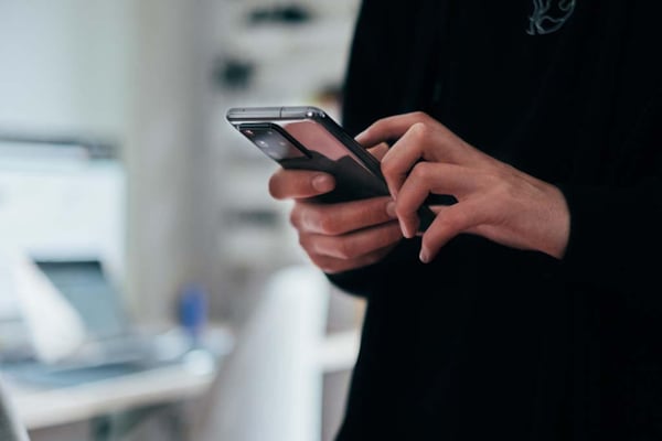 Doctor holding mobile phone